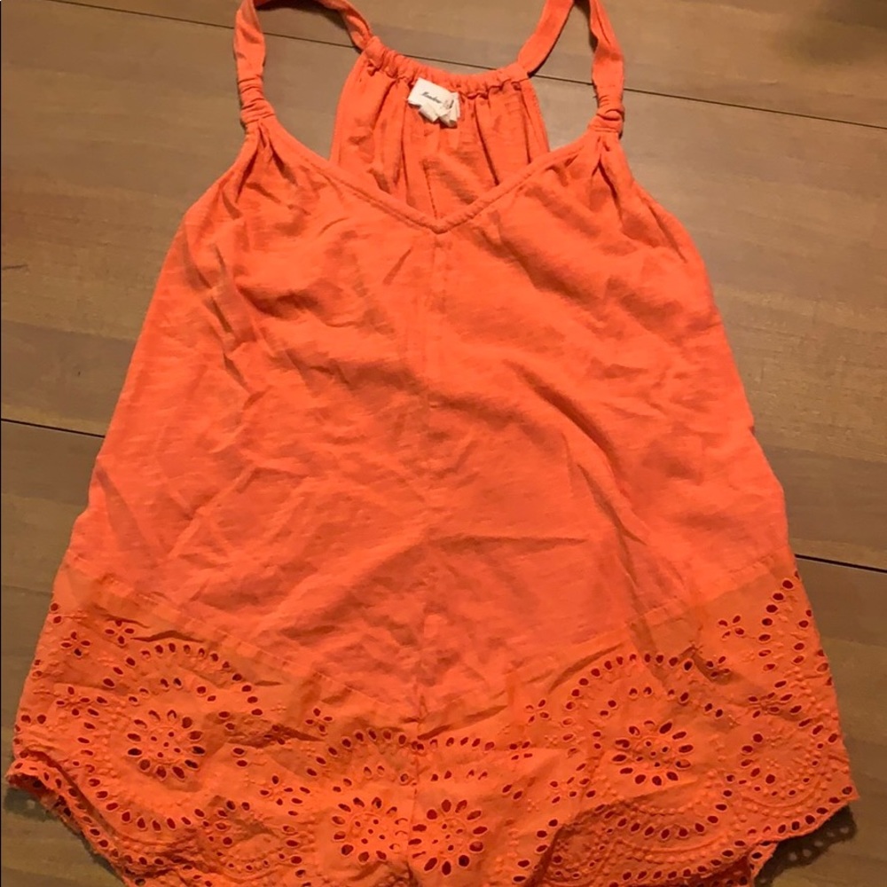 Burnt orange tank with eyelet detail at the bottom